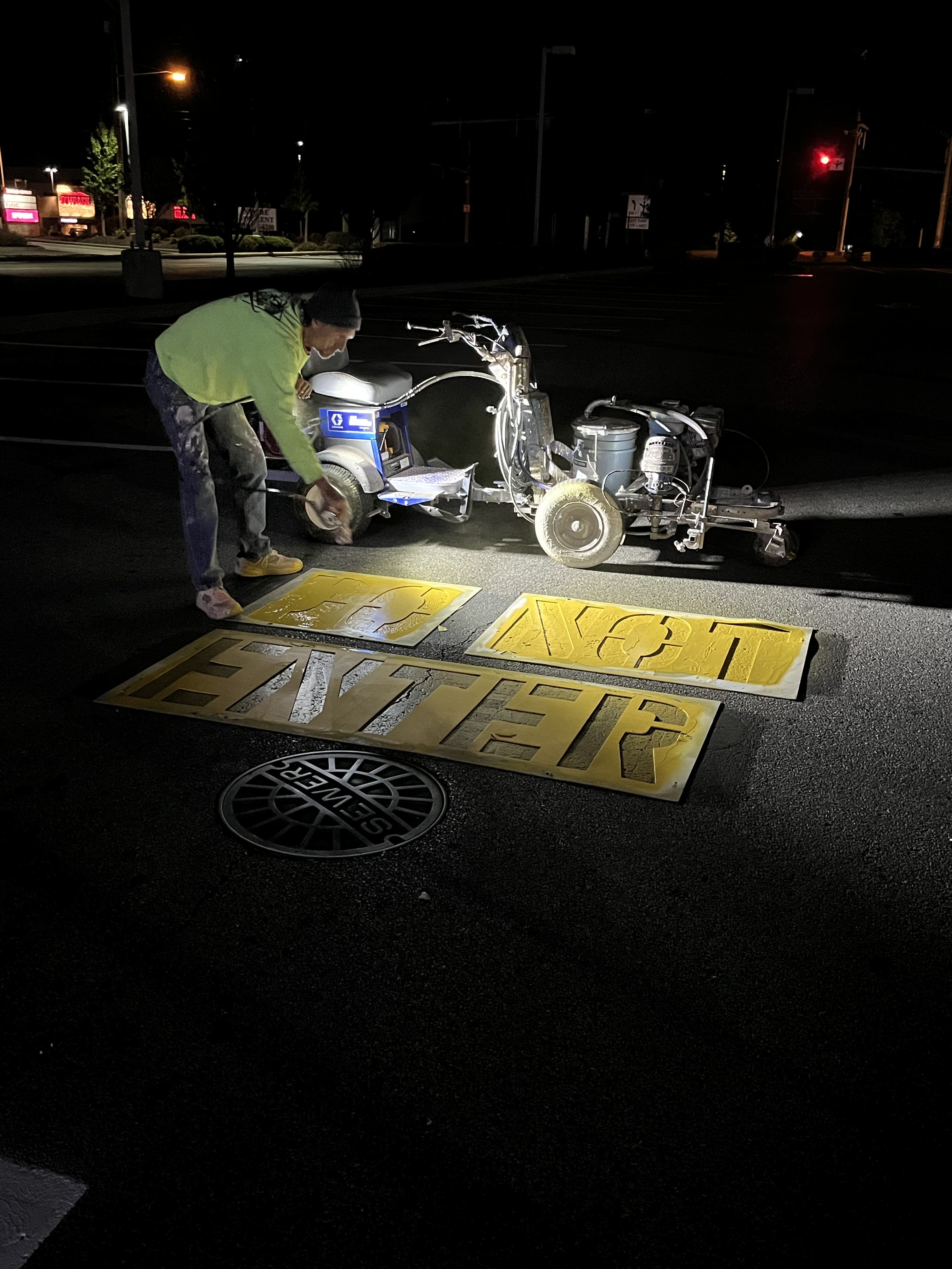 Night striping work on pavement